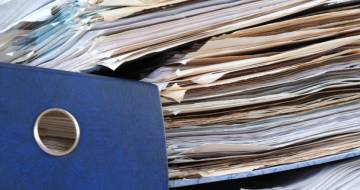 Afbeelding van een stapel administratieve lasten