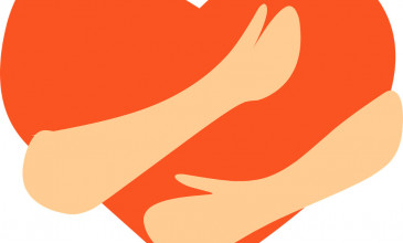 handen houden oranje hart vast